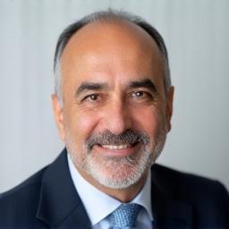 Professional headshot of Khalid Abbas